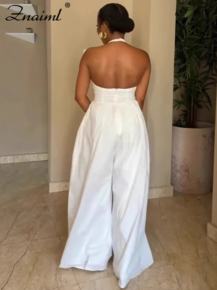 Mono elegante fiesta espalda descubierta pierna ancha cuello halter blanco negro modelo
